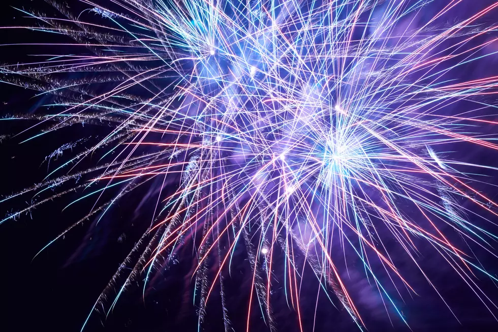 Blue colorful fireworks on the black sky background